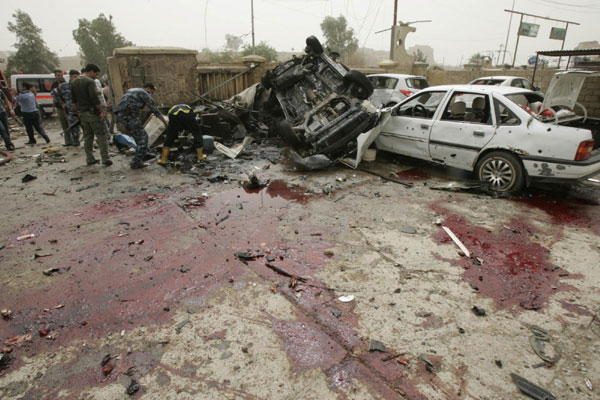 Twin bombs kill 27 at police station in Iraq