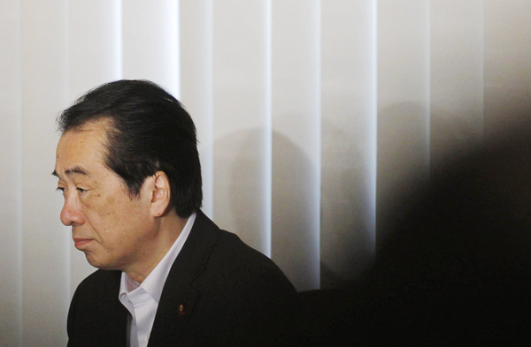 Japan coalition partner tells PM to quit