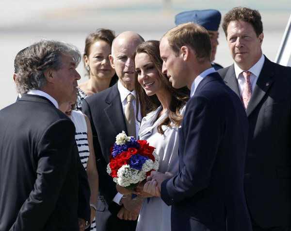 Britain's Prince William and his wife Catherine, Duchess of Cambridge, arrive at Los Angeles International Airport July 8, 2011. Kate and William land in Los Angeles for US trip