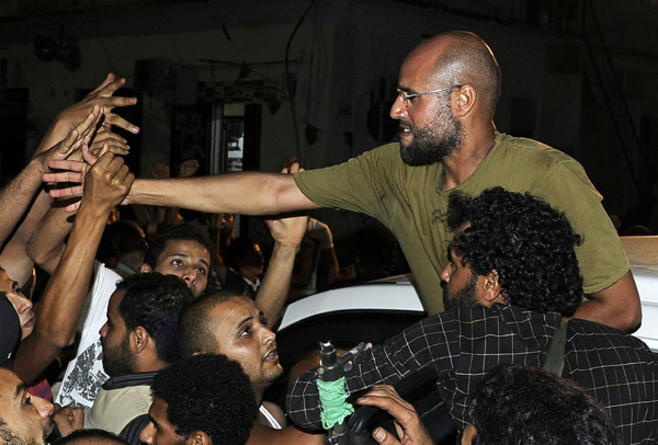 saif al islam son of muammar gadhafi greets supporters in tripoli on ...