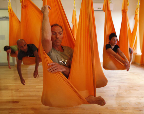 yoga with cloth hanging