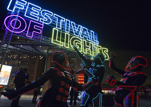 Dancers on Berlin Lights display