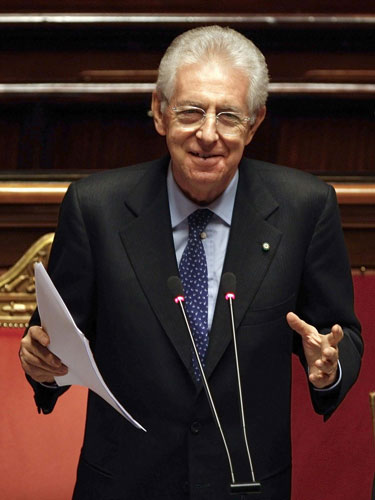 New Italy PM Monti easily wins confidence vote