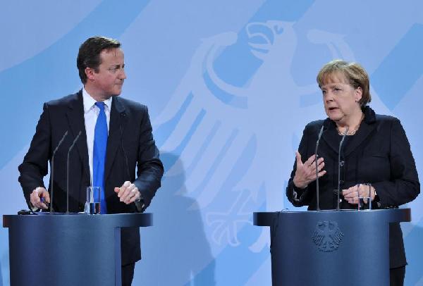 Merkel, Cameron differ on euro crisis weapons