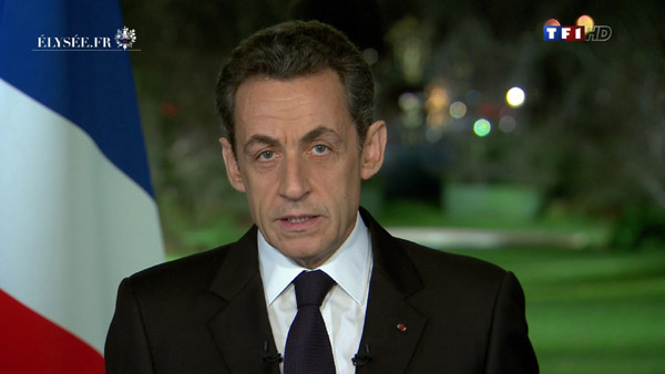 Sarkozy says debt crisis not over