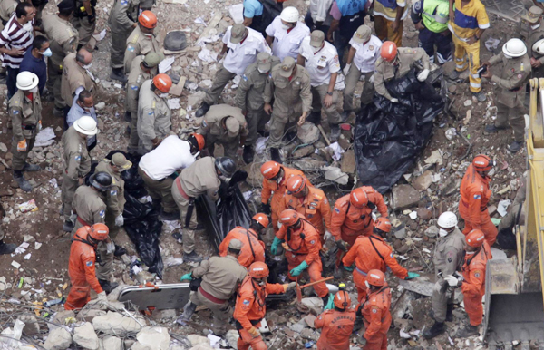 12 dead, 17 missing in Rio building collapse