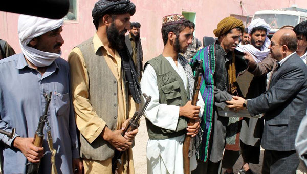 Taliban fighters attend surrender ceremony