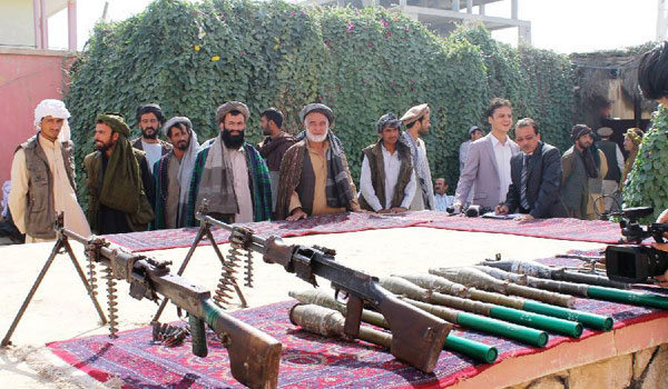 Taliban fighters attend surrender ceremony