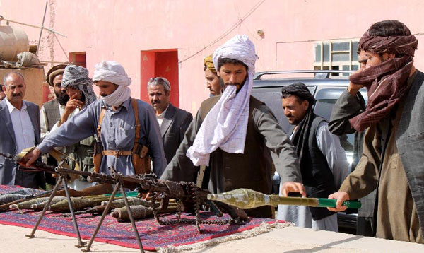 Taliban fighters attend surrender ceremony