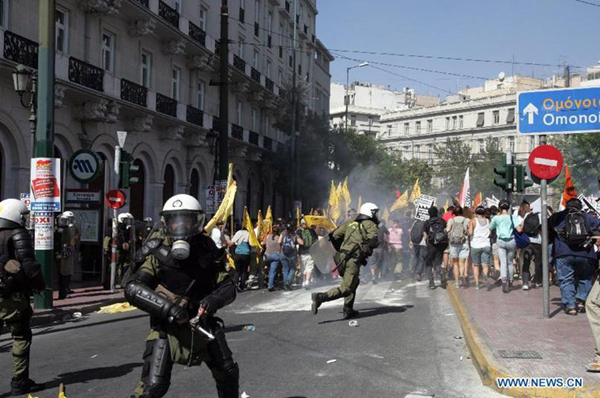 Protestors clash with anti-riot policemen in Athens
