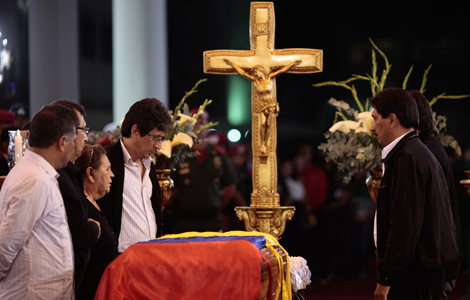 Chavez's coffin moved to military academy for wake
