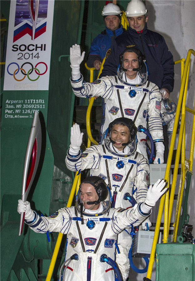 Soyuz rocket flies Olympic torch to space station