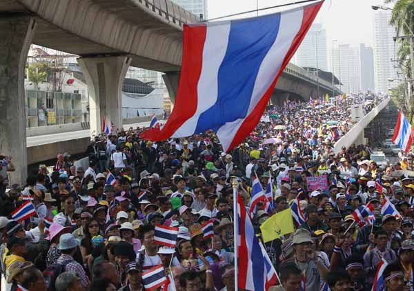 Thai protesters besiege caretaker PM's residence