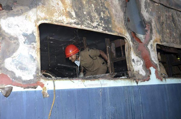 Fire on express train in India kills at least 26