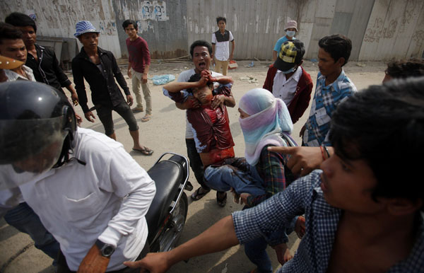 Cambodian police fire on strikers, killing 2