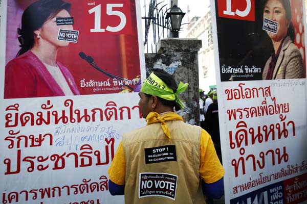 Thai caretaker PM urges protesters not to block voting