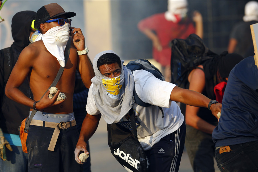 Protesters take part in clashes in Venezuela