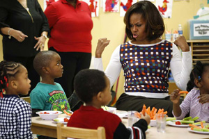 Obama sweats over sweaters during NY shopping stop