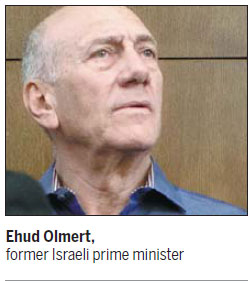 Israeli court convicts former leader Olmert of bribery