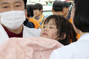 Family members of missing ferry passengers wait for words