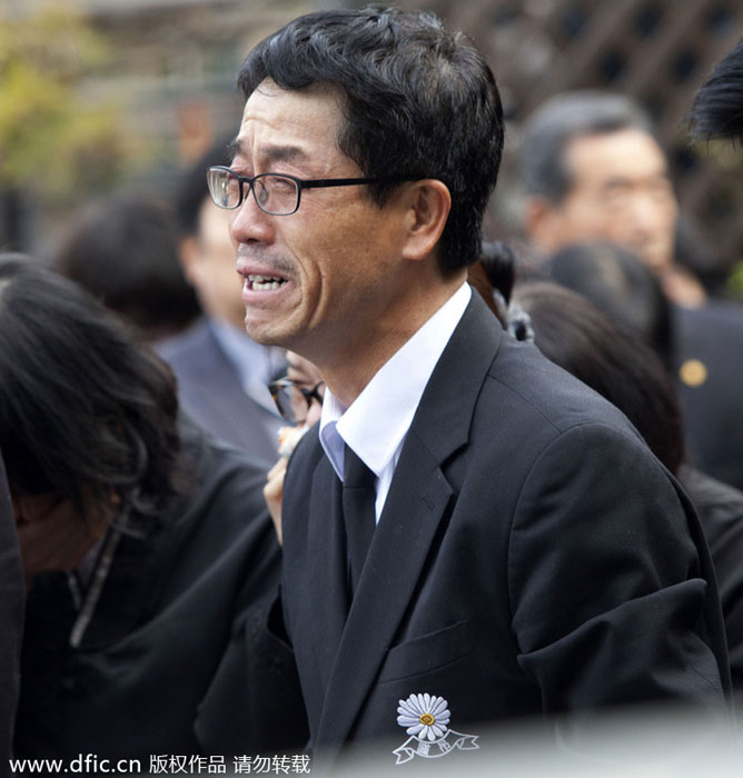 People suffer in funeral for victims, South Korea