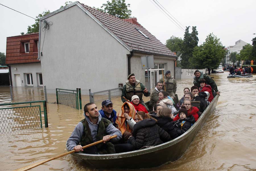 Bodies pulled from submerged homes in Balkans flooding