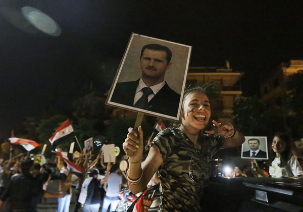 Assad secures victory in poll condemned by foes
