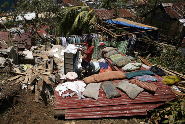 Philippine death toll from typhoon Rammasun rises to 64