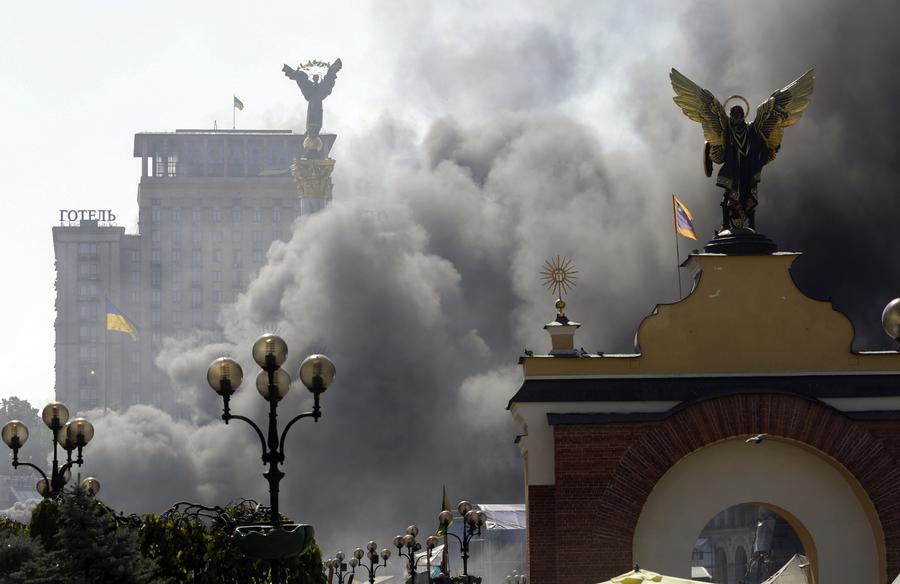 Smoke rises during clashes in Kiev