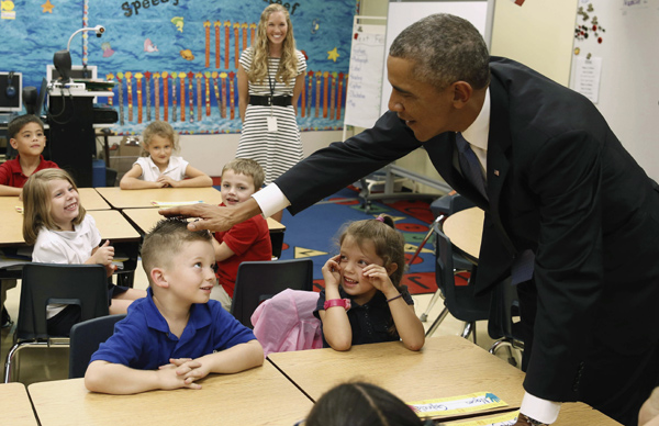 Obama entertains kids in elementary school visit