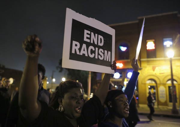 Arrests made in protests against killing of black young man in US