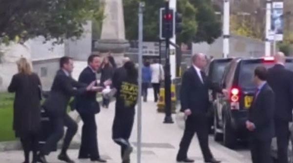 British PM Cameron is confronted in London