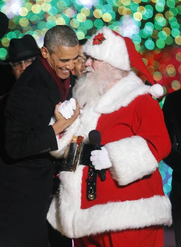 Obamas usher in Christmas with lighting of national tree