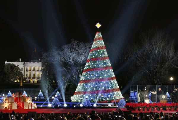 Obamas usher in Christmas with lighting of national tree