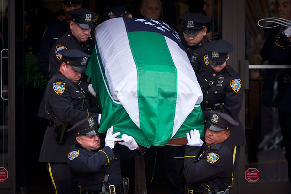 Thousands in NYC see off slain police officer