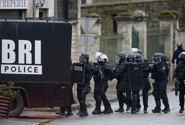 Armed French gendarmes swoop on villages in manhunt for newspaper attackers