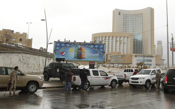 Nine killed as gunmen storm luxury hotel in Libyan capital