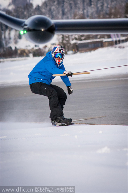 Snowboarder towed by plane reaches speed of 78mph