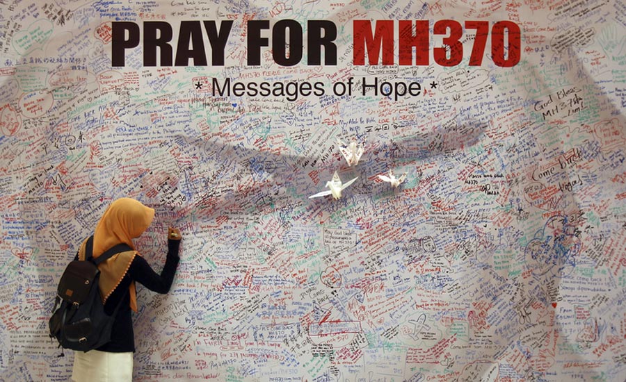 One year on, MH370 scar still hurts