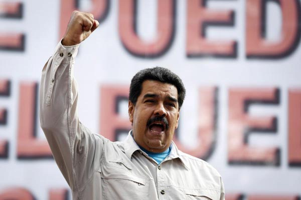 Venezuela's Maduro says may go to US to challenge Obama