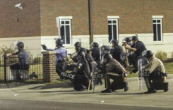 Police hunt for suspects after officers shot in Ferguson