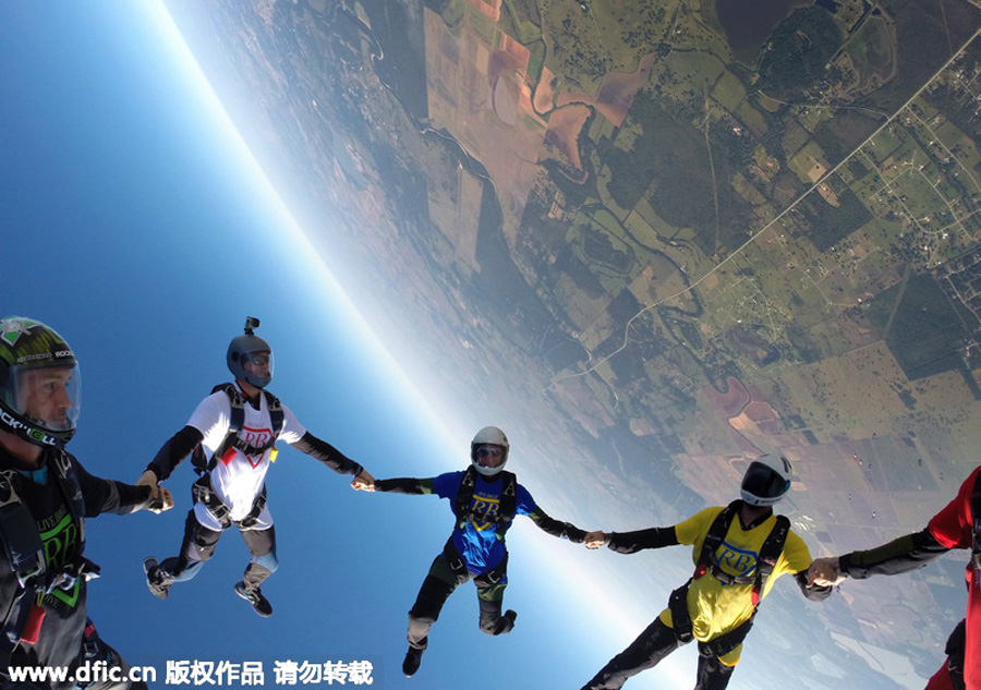 Skydivers perform breaking feat for departed friend