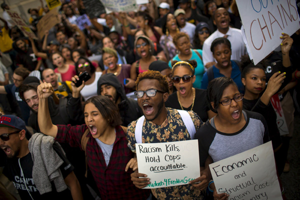 Marchers protest police violence in Baltimore, New York