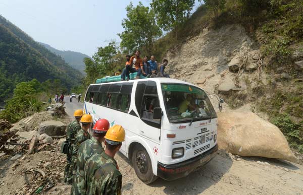 China's quake-relief armed police restore cross-border highway with Nepal