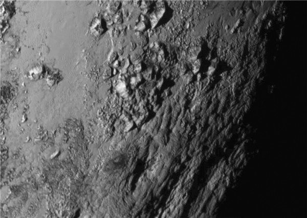 Tiny Pluto sports big mountains, New Horizons finds