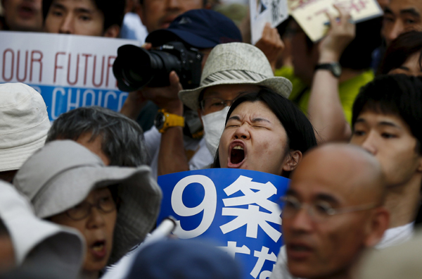 Abe gov't forcing war bills triggers anger