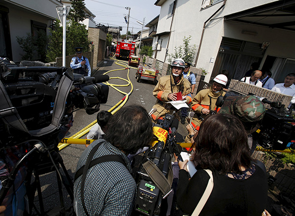 Small plane crashes in Tokyo neighborhood; 3 dead, 3 survive