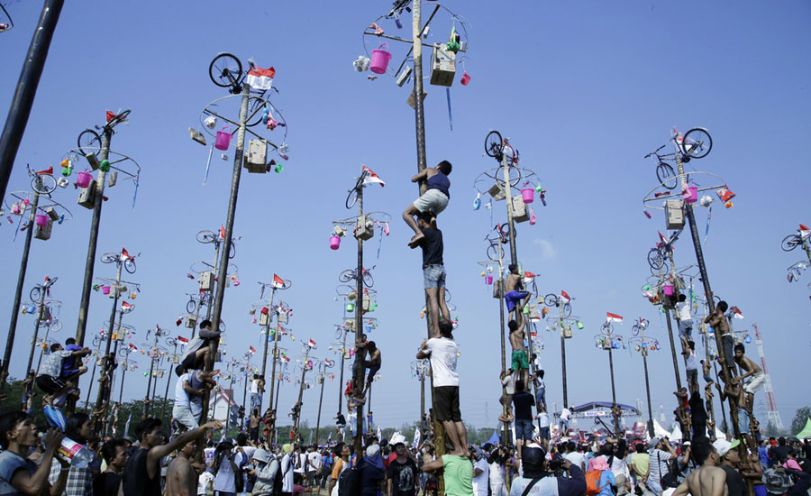 n Indonesia climb greased poles to win prizes[1