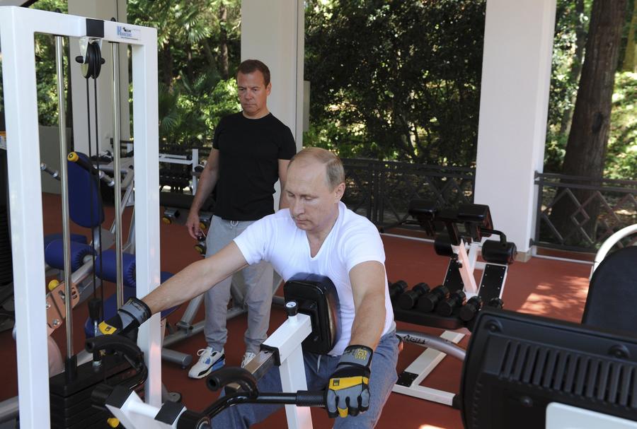 Russia's Putin works out in gym with Medvedev