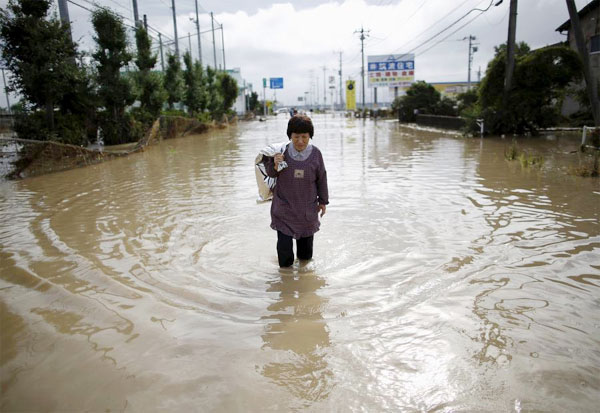 More Japanese rivers overflow bringing further floods, 23 missing